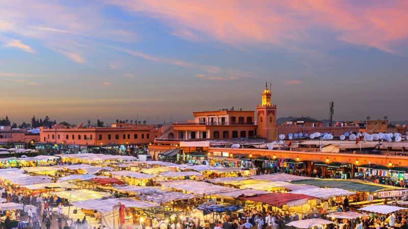 Famous Djemaa El Fna Square in early evening light, Marrakech, Morocco with the Koutoubia Mosque, Northern Africa